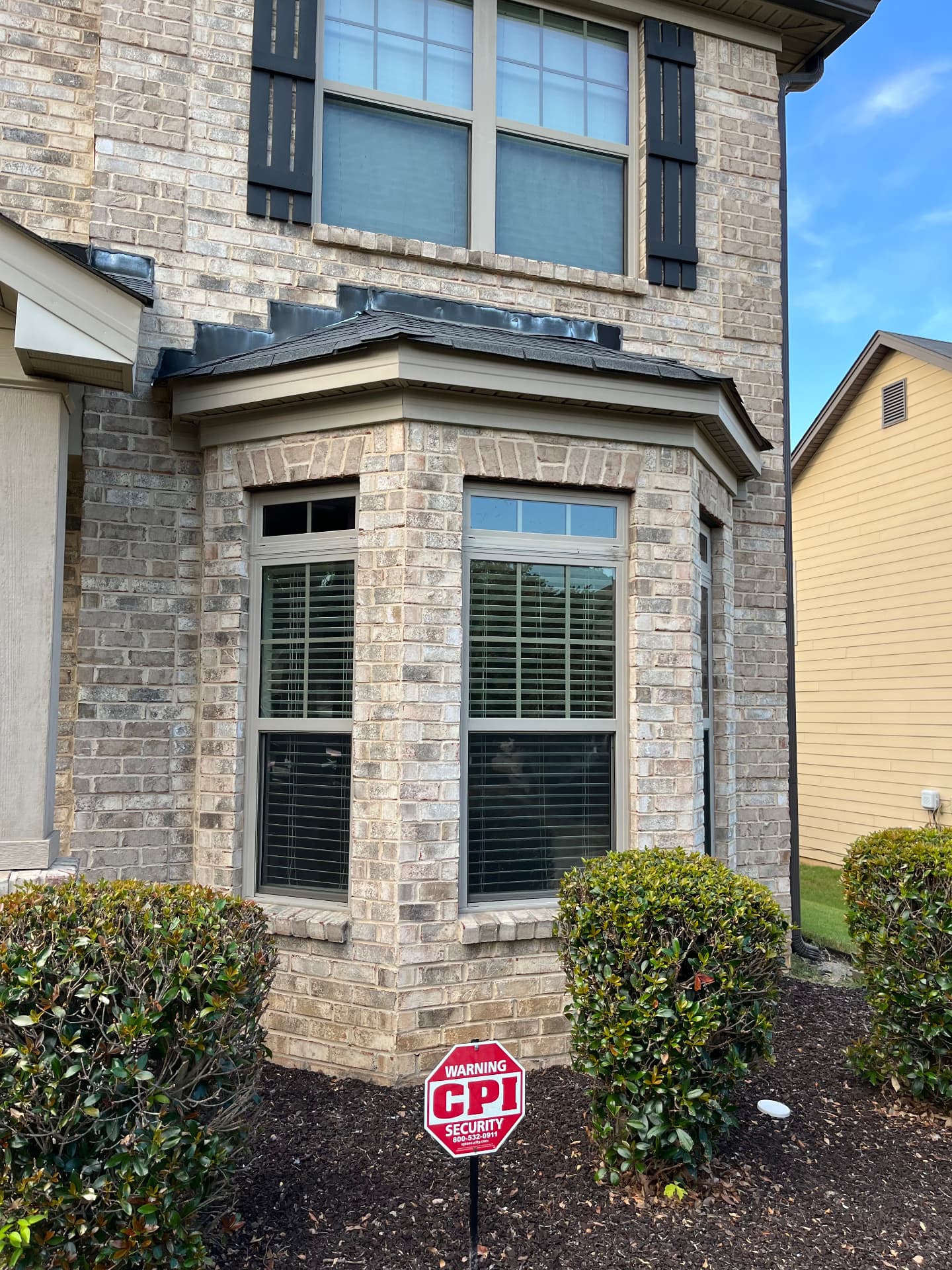 Residential window tinting on a brick home exterior in Gwinnett County, GA