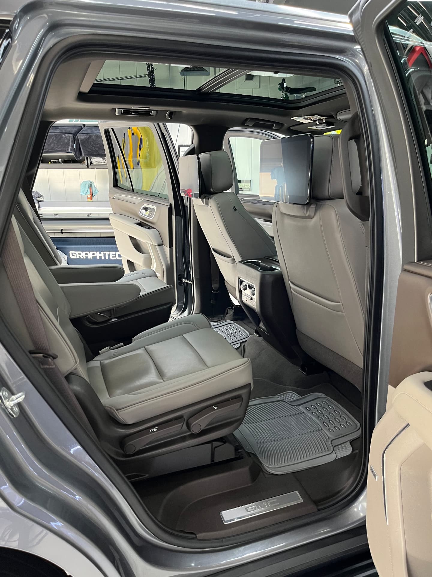 Deep interior auto detailing on a GMC Yukon second row in Snellville, GA