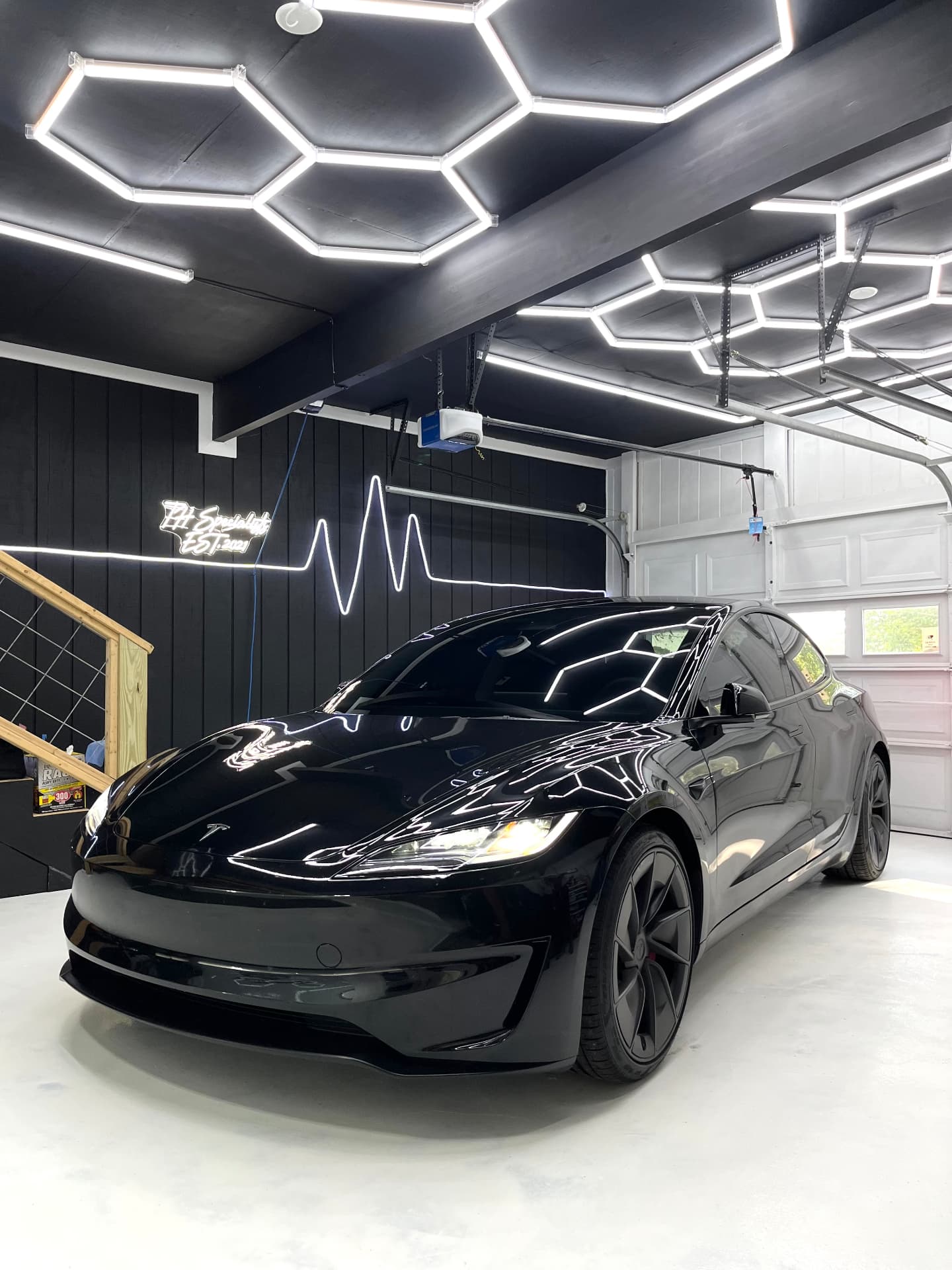 Black Tesla Model 3 with ceramic window tint at the THSpecialists shop